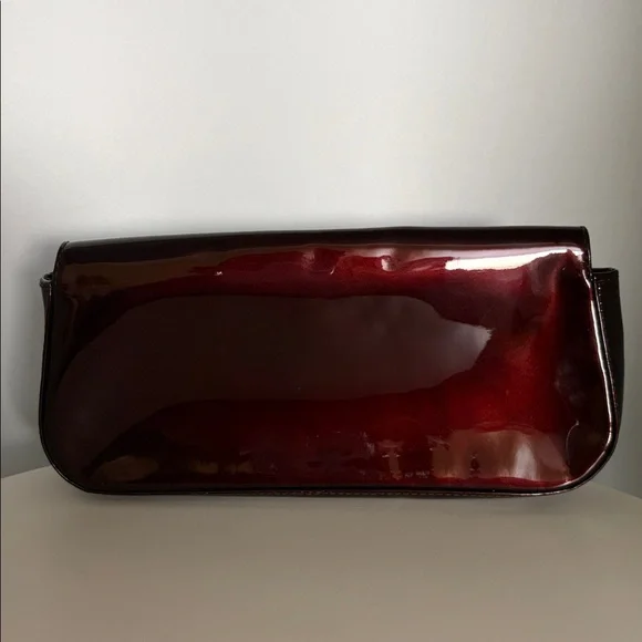 Louis Vuitton Burgundy Sobe clutch with Brass Hardware
